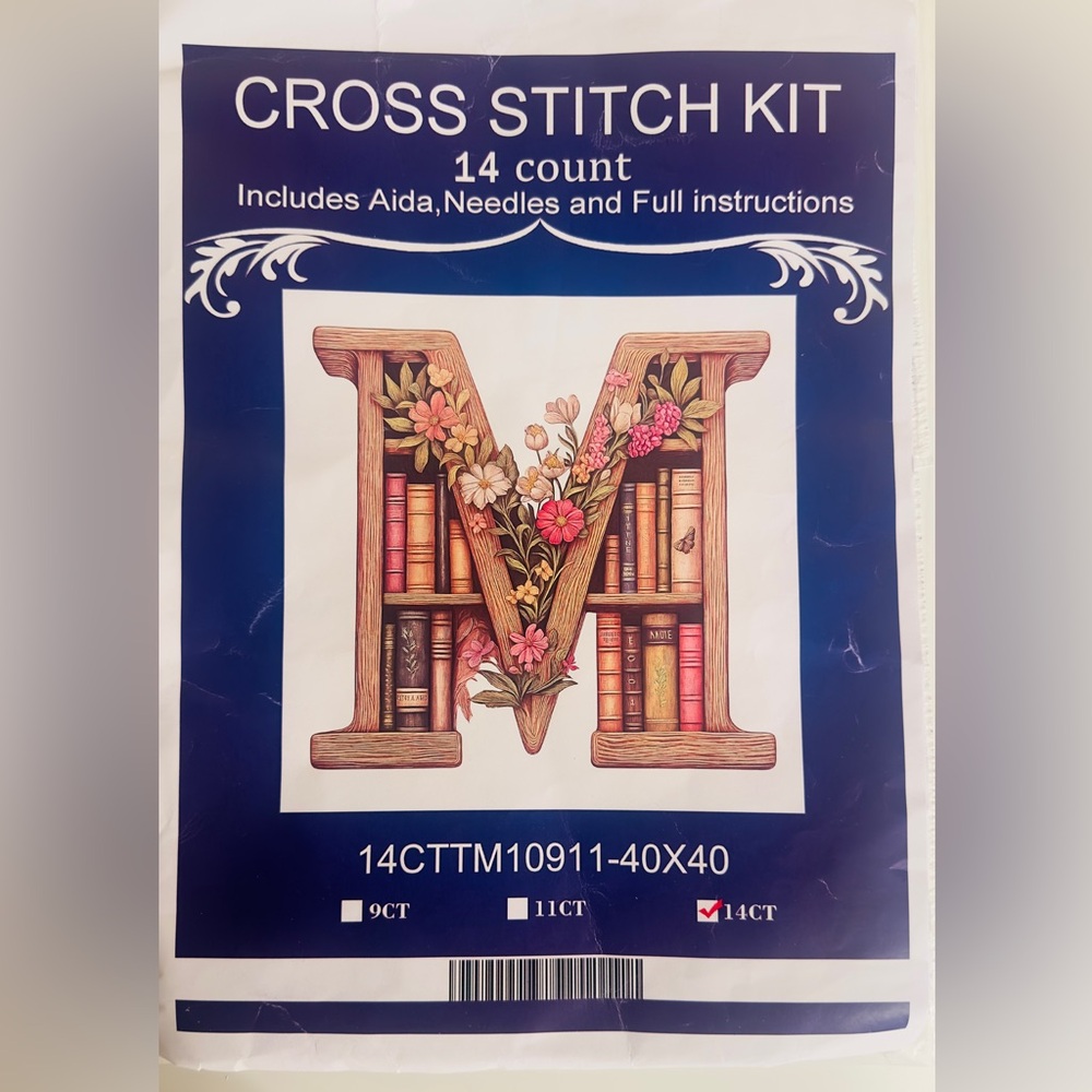 Cross Stitch Floral Alphabet Letter “M” Filled With a Bookshelf Design